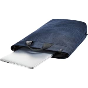 A navy laptop backpack with a sleek design, featuring handles and a silver laptop partially inserted.