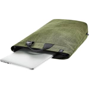 A green laptop backpack with a sleek design, featuring a handle and a partially visible silver laptop inside.