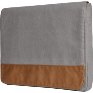 A grey laptop bag featuring a tan bottom panel and a flap closure, with a logo on the front.