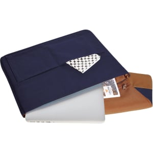 A navy and brown laptop bag with a patterned pocket, featuring a logo, holding a silver laptop inside.