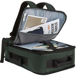 A green active travel backpack opened, revealing compartments with documents and a laptop sleeve. It has a logo.
