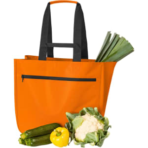 An orange tote bag with black handles, filled with zucchini, leeks, and a cauliflower. The bag has a zippered pocket.
