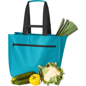 A teal soft tote bag with black straps, alongside a cauliflower, zucchini, yellow capsicum, and leeks.