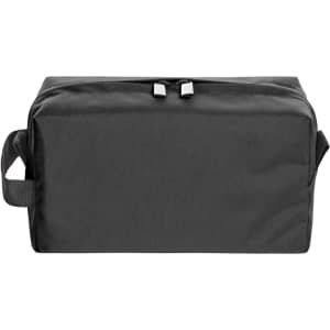 A black toiletry bag with a zippered top, featuring a side handle and a minimalist design. It has a logo on one side.
