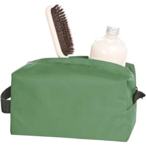 A green toiletry bag containing a brush and a drink bottle. It features a simple design and has a handle.
