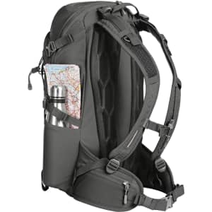 A charcoal grey outdoor backpack with a water bottle and map visible in side pockets. Features multiple straps and compartments.