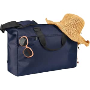 A navy duffle bag with a straw hat and sunglasses resting on top, featuring a logo.