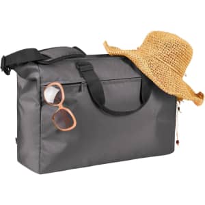A grey duffle bag with a strap, paired with a straw hat and sunglasses. The bag features a logo.
