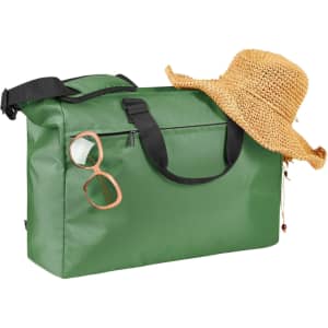 A green duffle bag with black straps, accompanied by a straw hat and sunglasses. The bag features a branding logo.