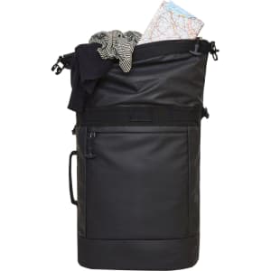 A black active backpack filled with clothing and a map, featuring a top opening and side pocket.