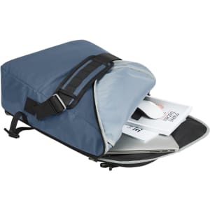 A blue notebook bag with a partially open flap, revealing a laptop, documents, and a mouse inside.