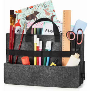 A grey felt organiser bag filled with stationery items, including scissors, markers, glue, and rulers.