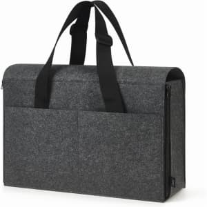 A grey laptop bag with a structured design, featuring black handles and two front pockets. It has a logo on the side.