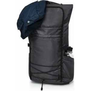 A black Flex Notebook Backpack with a water bottle in a side pocket and a jacket draped over the top.