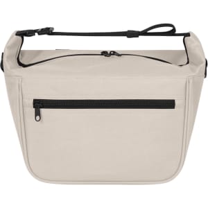 A soft beige lunch bag with a zippered front pocket and an adjustable strap. It features a simple design with a logo.