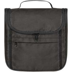 A black toiletry bag with a zippered front pocket and a handle on top. It features a foldable design and has branding.