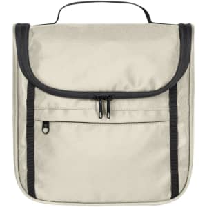 A light beige toiletry bag with a flap, black trim, and zippered pockets. It has a handle for easy carrying.