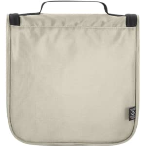 A cream toiletry bag with a black handle, featuring a simple design and a branded label.