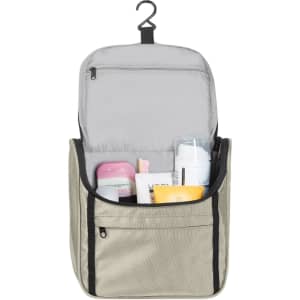 A toiletry bag in beige with a hook, featuring various personal care items inside. It has one zippered section.