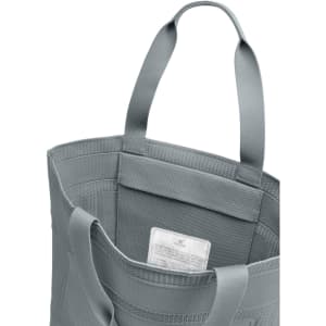 A grey tote bag with two handle straps and a textured interior. It includes a tag inside.