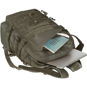 A green Molle notebook backpack with an open compartment revealing a laptop and a notebook inside.