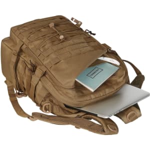 A tan Molle notebook backpack with multiple compartments, including space for a laptop and a notebook. It features straps and a logo.