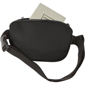 A black bum bag with a zippered closure and an adjustable strap, containing a notebook inside.