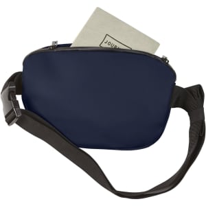 A navy bum bag with a zipper closure and an adjustable strap, containing a notebook inside. It features a logo.