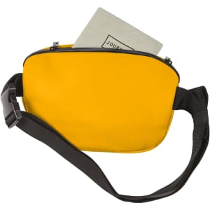 A yellow bum bag with a zippered closure and a black adjustable strap, containing a notebook inside.