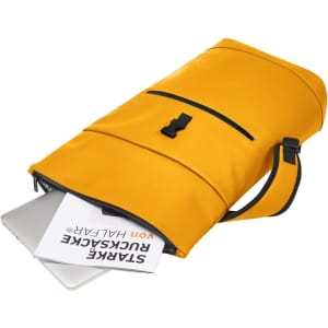 A yellow laptop backpack opened, displaying a laptop and notebook inside, with a black strap and logo.