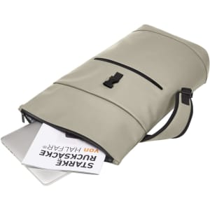 A grey laptop backpack with a top closure, featuring a handle and zipper pocket, holding a laptop and documents inside.