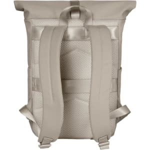 A beige backpack with padded shoulder straps and mesh detailing on the back. The backpack features a logo.