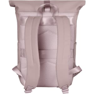 A light pink backpack with padded shoulder straps and a textured back panel, featuring a logo.