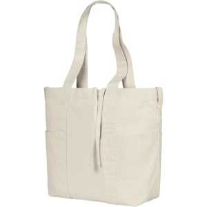 A light beige tote bag with long handles and side pockets, featuring a simple design and a logo.