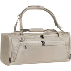 A beige duffle bag with multiple zippered pockets and an adjustable shoulder strap, featuring a logo.