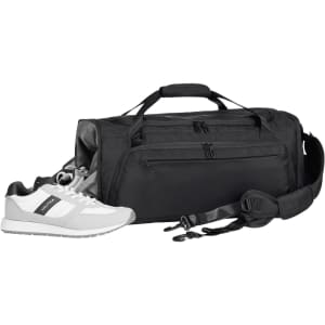 A black duffle bag with a shoulder strap, accompanied by a pair of white and grey sneakers. The bag features a logo.
