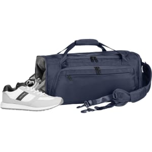 A navy duffle bag with multiple compartments, accompanied by a pair of white athletic shoes. The bag features a logo.