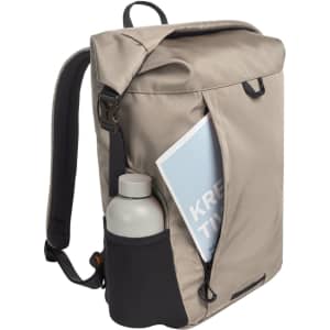 A beige backpack with a side pocket holding a drink bottle and a visible folder inside. It has a logo on the front.