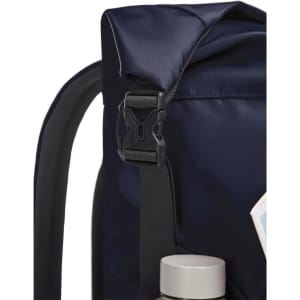 A navy backpack featuring a buckle strap and a drink bottle peeking from the side, with a logo visible.