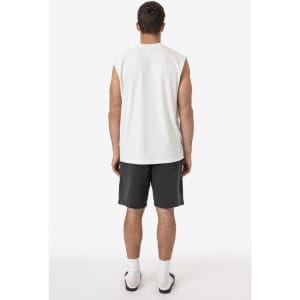 A sleeveless white tee is displayed on a model, paired with grey shorts and white socks. There is a logo on the shirt.
