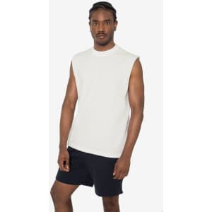 A sleeveless white tee with a minimalist design, paired with black shorts, displayed on a model.