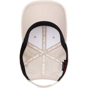 A low-profile perforated baseball cap in beige with a black interior, featuring a logo inside.