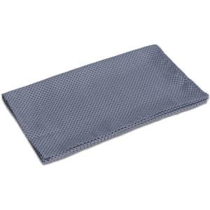 A neck scarf in a textured, light blue fabric, featuring a dotted pattern and folded neatly.