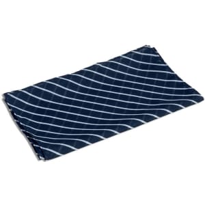A navy neck scarf with a diagonal white striped pattern, featuring a logo in one corner.