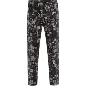 Black pants featuring various travel-themed patterns in grey tones, along with a logo on the waistband.