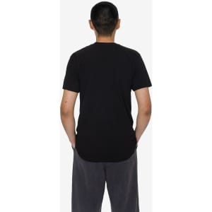 A plain black short sleeve fine jersey crew tee displayed on a person from the back, hands in pockets.