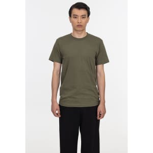 A plain olive green short sleeve fine jersey crew tee displayed on a model, featuring a logo.