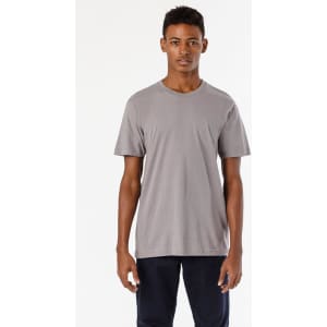 A fine jersey crew tee in grey, featuring short sleeves and a simple design, worn by a model standing upright.