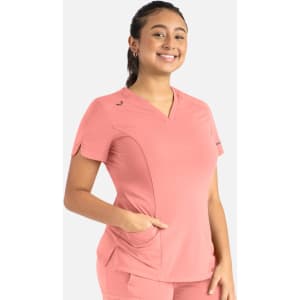 A curved V-neck top in coral pink with short sleeves and a pocket, featuring a logo on the chest.