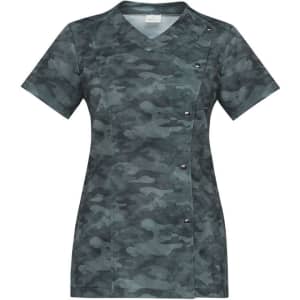 A short-sleeved tunic featuring a green camouflage pattern, with a V-neck and button detailing on the side.